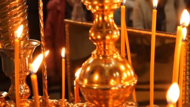 Russian Orthodox Church. Burning candles on a candlestick — Stock Video