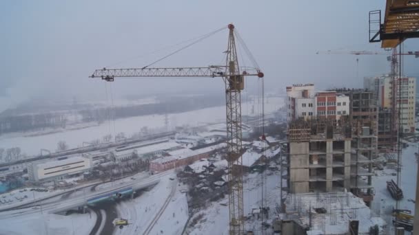 Winter construction. With the boom of a crane. — Stock Video