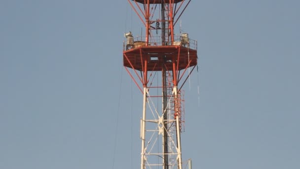 Telecommunication tower with antennas of cellular communication in the sky — Stock Video