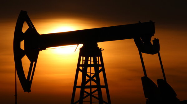 Oil production. Oil pumps at sunset