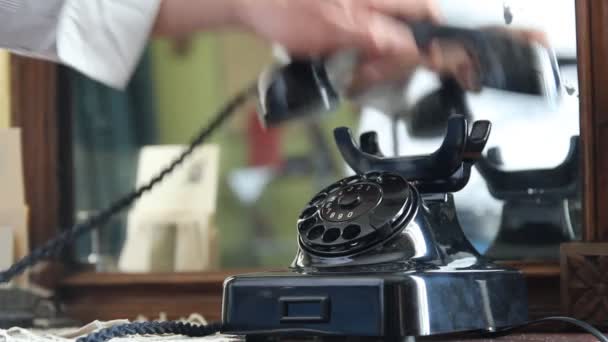 Vintage black telephone. Man dials — Stock Video