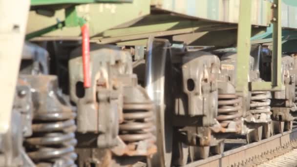 Closeup of passing freight train wheels — Stock Video