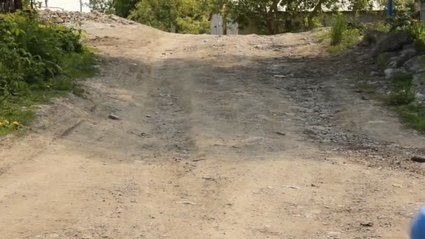 Blonde boy running on rural road — Stock Video