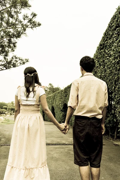 Couple hold hands — Stock Photo, Image
