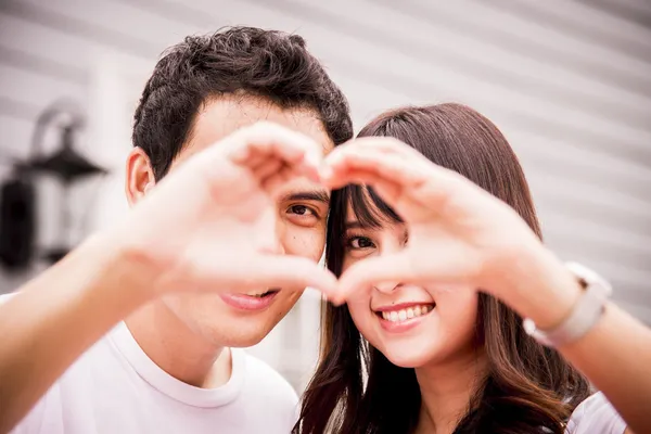 Lovely couple with love hand sign2 — Stock Photo, Image