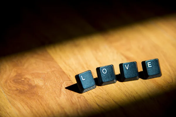 Liefde woord op het laminaat floor1 — Stockfoto