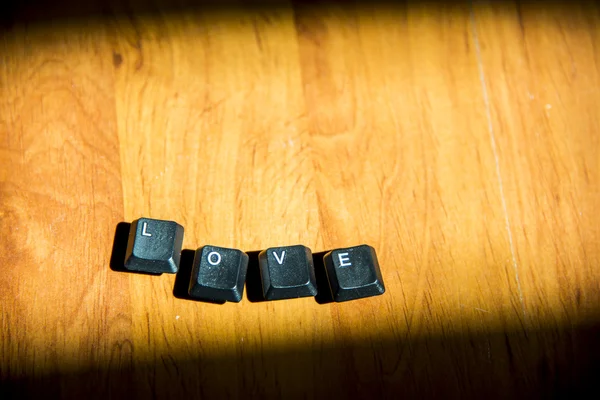 Love word on the laminate floor4 — Stock Photo, Image