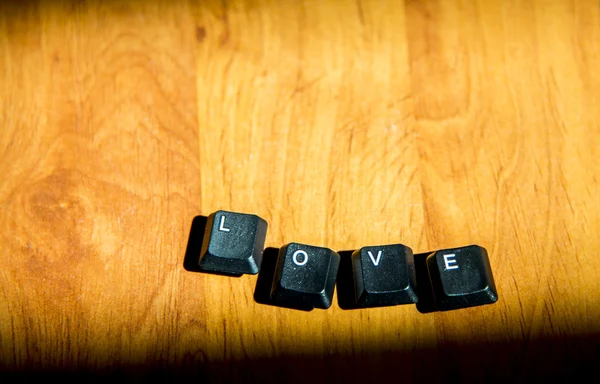 Love word on the laminate floor5 — Stock Photo, Image