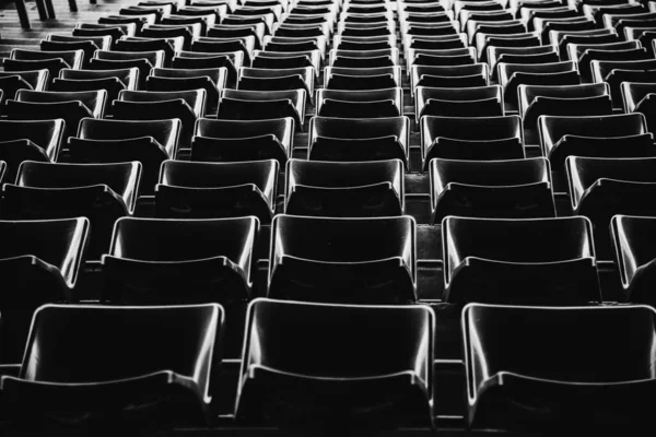 Black and white concept of backside seats pattern in Football sport stadium for background concept idea