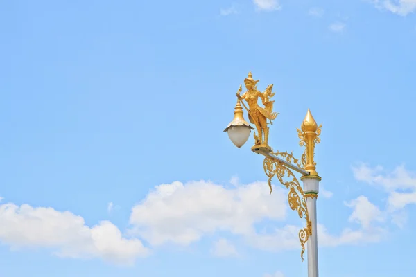 Half-bird half-woman on street lamp — Stock Photo, Image