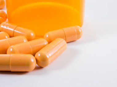 Pills by a pill bottle