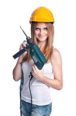 Sarı baret takmış matkap ile kız