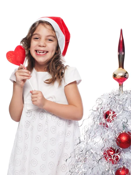 Felice Bambina che Indossa Babbo Natale con forma di cuore lecca-lecca — Foto Stock