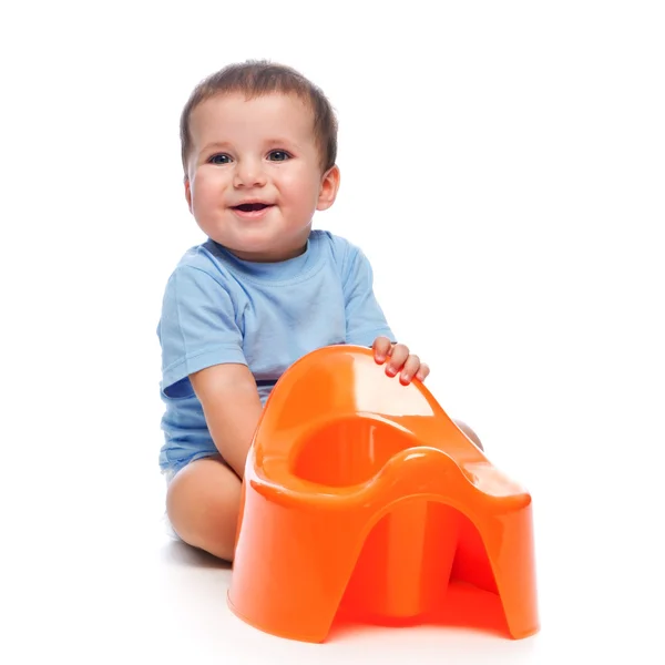 Happy little boy with potty Stock Picture