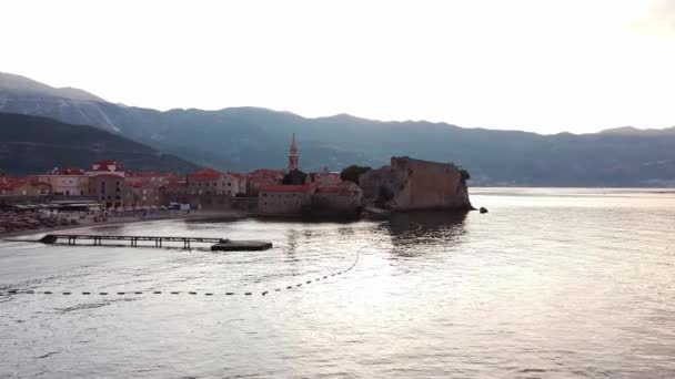 Aerial view of wall ruins of the historical city part. Drone Shot of old town Budva in Montenegro. — Video Stock