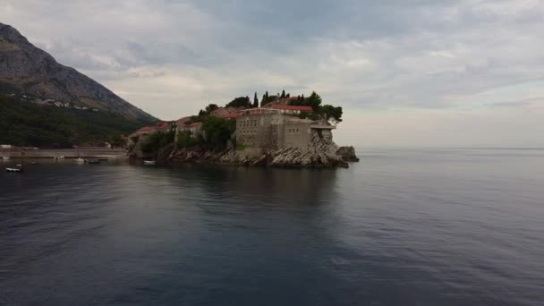 Drone view of old buildings with red roof located on sea island — Wideo stockowe