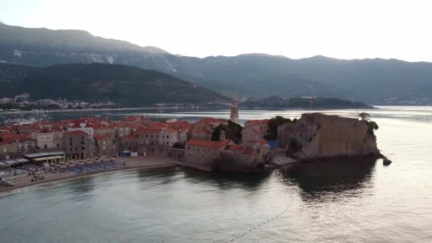 Aerial: coastal city with old ruins. Drone Shot of old town Budva in Montenegro. — 图库视频影像