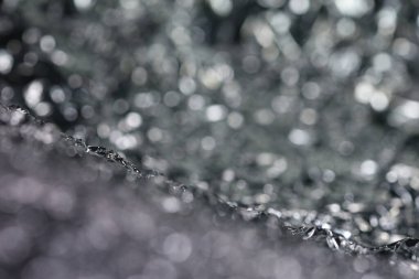 Gri parıltılı ışıklar dokusu. Soyut Noel arkaplanı.