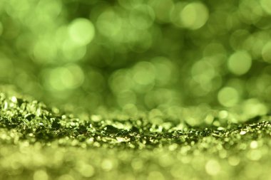 Yeşil parıltı ışık dokusu. Soyut Noel arkaplanı.