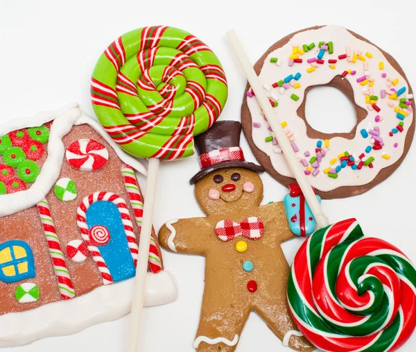 Pan de jengibre hombre, casa y piruletas — Foto de Stock