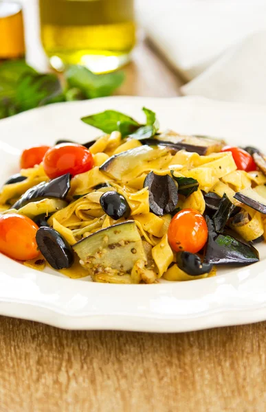 Carrot Fettuccine with aubergine and olive — Stock Photo, Image