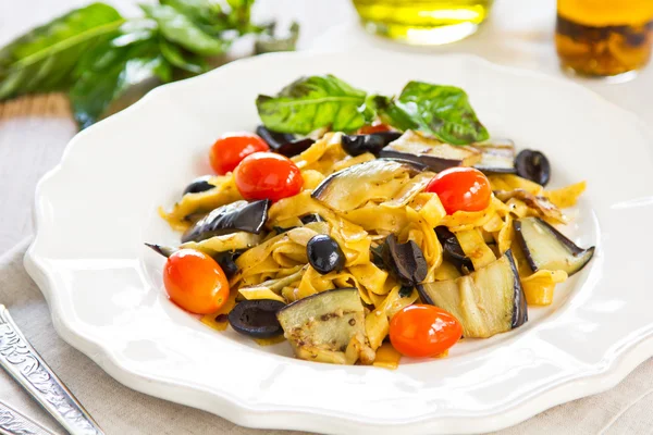 Carrot Fettuccine with aubergine and olive — Stock Photo, Image