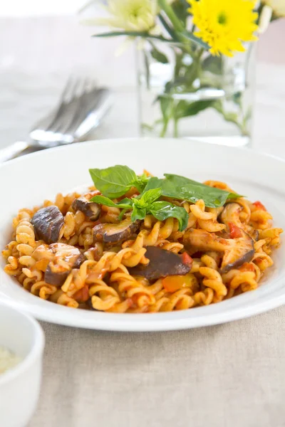 Fusilli with mushroom in tomato sauce — Stock Photo, Image