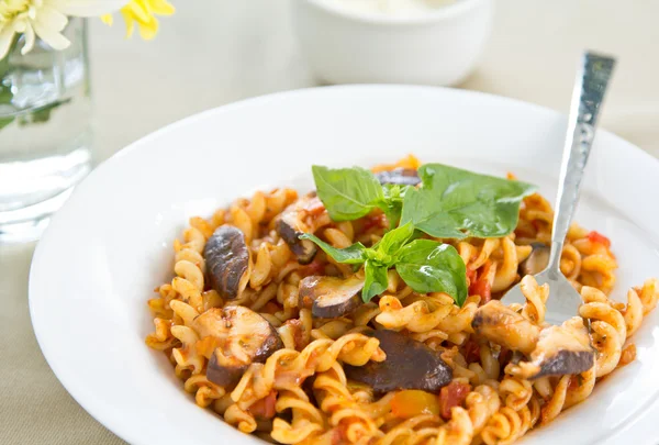 Fusilli with mushroom in tomato sauce — Stock Photo, Image