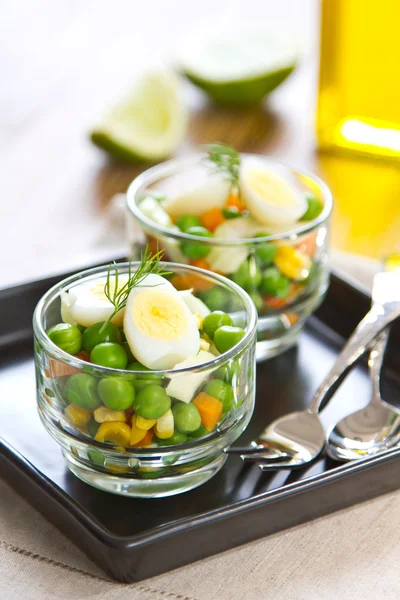 Quail eggs with peas salad — Stock Photo, Image
