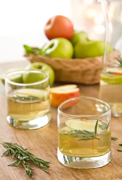 Apple juice with rosemary — Stock Photo, Image