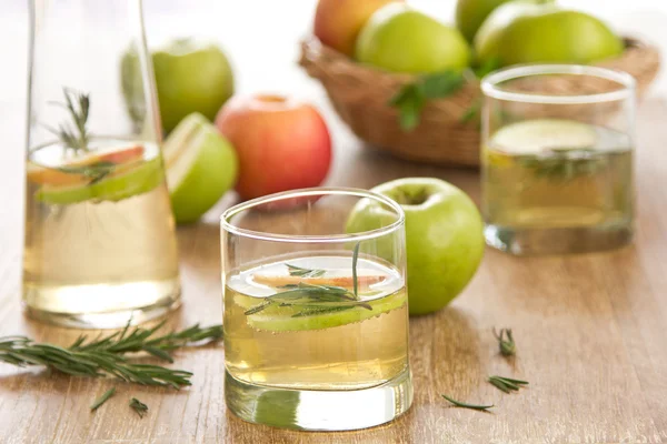 Apple juice with rosemary — Stock Photo, Image