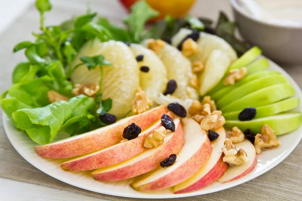 Apple, grapefruit, walnut salad — Stock Photo, Image