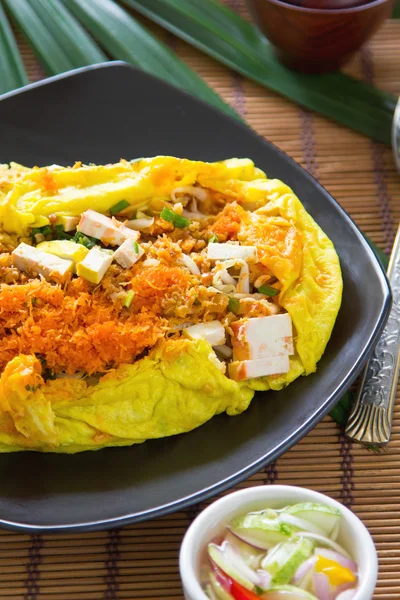 Stir fried wrapped in omelet — Stock Photo, Image
