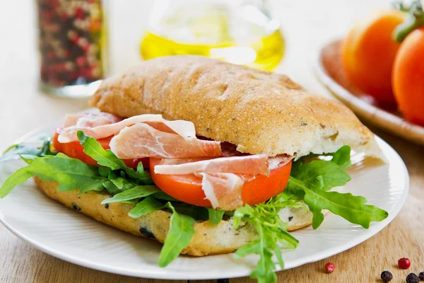 Prosciutto on Olive Ciabatta sandwich — Stock Photo, Image