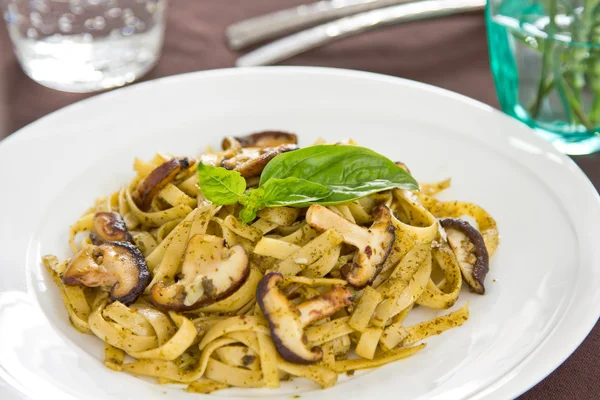 Fettuccine and mushroom with pesto — Stock Photo, Image