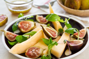Fig, cantaloupe and almond salad clipart