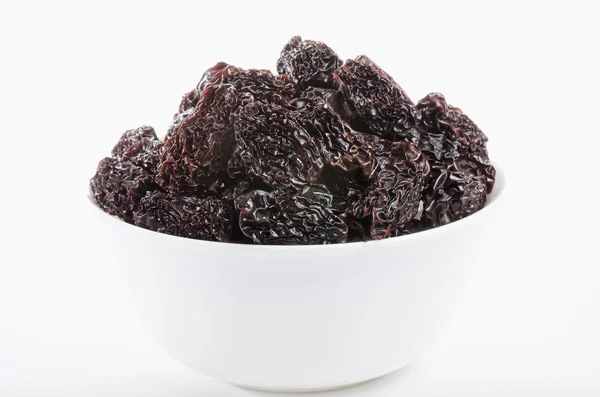 Beyaz kase kuru siyah tarihleri ile dolu