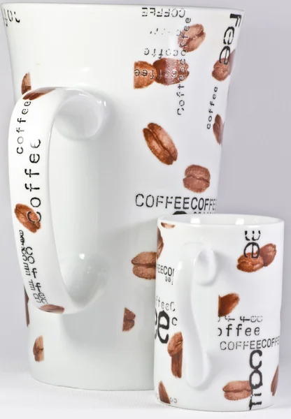 Grote koffiemok en kleine espresso-kopje — Stockfoto