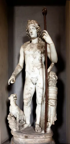 Ancient Greek statue of Dionysus with a dog — Stock Photo, Image