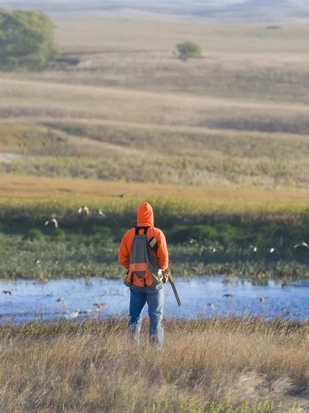 Hunter on the prairie — Stock Photo, Image