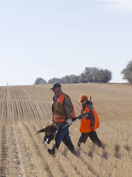 Grandpa and grandson hunting — Stock Photo, Image