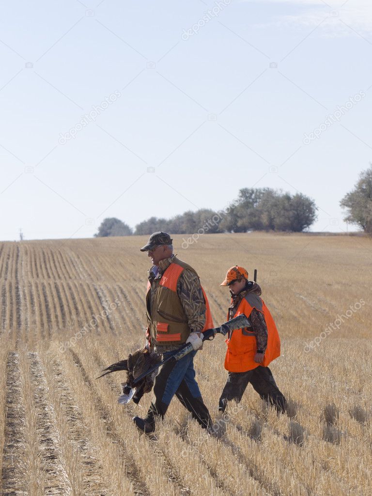 Grandpa and grandson hunting