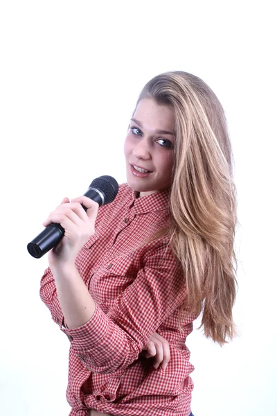 Girl singing in microphone — Stock Photo, Image