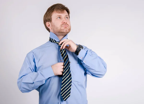 Business man making his tie — Stock Photo, Image