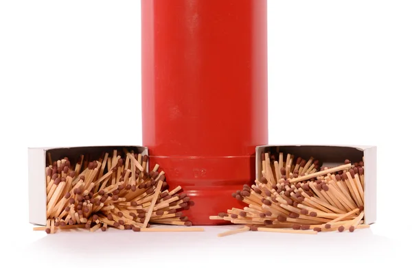 Red fire extinguisher and matches — Stock Photo, Image