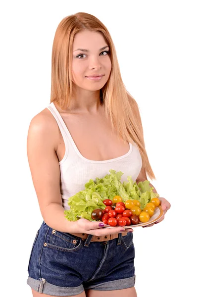 Girl with a plate of vegetables — Stock Photo, Image