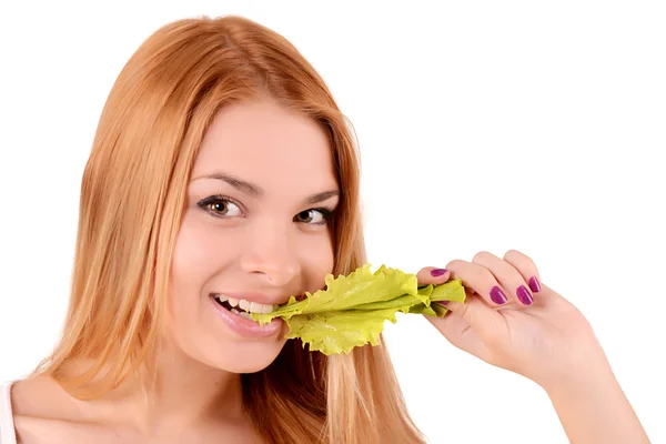 Portrait of a girl biting a leaf of lettuce — Stock Photo, Image