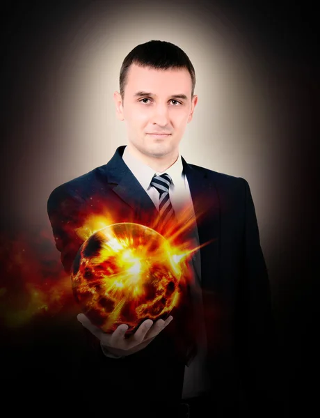 A man in a suit with the sun in his hand — Stock Photo, Image