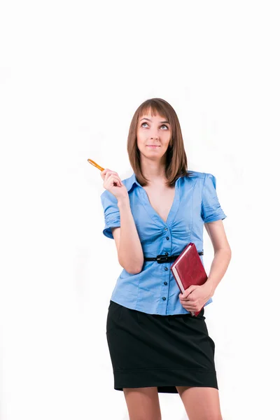 Thoughtful girl with pen and notepad — Stock Photo, Image