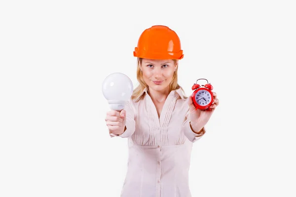 Chica con una lámpara y un reloj — Foto de Stock